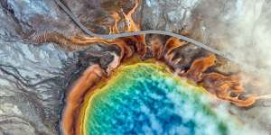 An overhead view of the Grand Prismatic Spring in Yellowstone National Park. Climate change is altering America's first national park so quickly that plants and animals may not be able to adapt. 