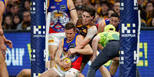 Will Day tackles the Lions’ Ryan Lester in their recent clash,won by Hawthorn.