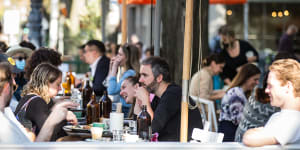 Vaccinated Melburnians eat out again as the city reopens.