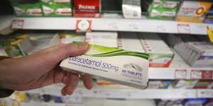 A customer inspects a box of Paracetamol tablets at a supermarket in Sydney.