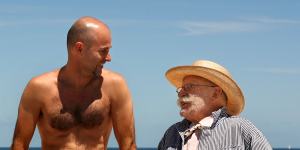Swimwear designer Peter Travis with his nephew,Jamie Travis,at Bondi Beach in 2008. 