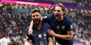 Olivier Giroud (left) celebrates the winning goal.