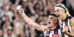 Collingwood defenders Brayden Maynard and Darcy Moore celebrate.