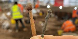 Two Roman hairpins from the dig in Leicester. On the left,a pin with a spherical head carved from animal bone,and on the right a copper alloy pin with a grooved head (probably broken).