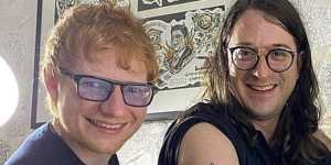Ed Sheeran with Matt Gudinski as he gets a tattoo as a tribute to his father.