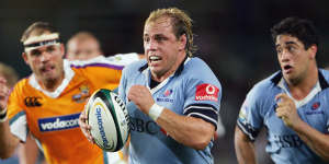 Phil Waugh on the charge for the Waratahs in 2006. He retired in 2011 as NSW’s most capped player and captain.