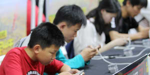 Young Chinese gamers play Tencent’s popular Honour of Kings adventure game.