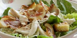 Caesar salad with barbecue chicken or chicken thighs.