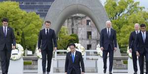 From left,Canada’s Justin Trudeau,France’s Emmanuel Macron,Japan’s Fumio Kishida,US’s Joe Biden,Germany’s Olaf Scholz,and Britain’s Rishi Sunak,walk back after placing a wreath at the Hiroshima Peace Memorial Park on Friday.