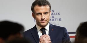 Macron narrowly survives no confidence motions amid pension protests