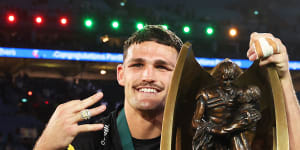 Nathan Cleary celebrates with the trophy.