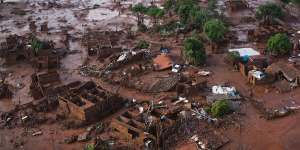 Homes lay in ruins in Bento Rodrigues,Minas Gerais,Brazil,after the Samarco dam burst on November 5,2015. 