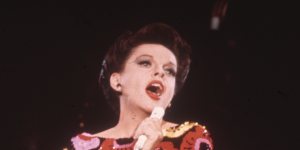 For her first Sydney concert,Garland wore a striking dress with a poppy theme (pictured here from a performance for her US TV show).