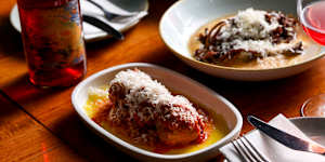 Meatballs served with melting parmigiano toupees and a rich glug of Napoletana.