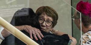 Cecilia Devine’s mother Kathy Pearson hugs friends of her daughter at the Coroners Court.
