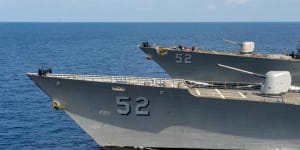 Rising tensions:US Navy ships pass through the South China Sea.