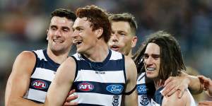 Mark O’Connor,Gary Rohan,Shaun Higgins and Gryan Miers of the Cats celebrate.