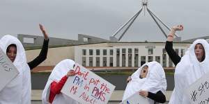 2015:Giant dancing tampons protest against the GST on sanitary products on the front lawn of Parliament House.