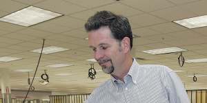 How it began:Netflix co-founder Reed Hastings looks through DVD envelopes in 2005.