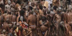 Naked Hindu holy men gather to take holy dips in the Ganges River during Kumbh Mela,or pitcher festival,in Haridwar,northern state of Uttarakhand,on April 12.