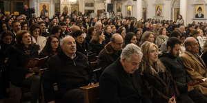 Syrians attend a Christmas Eve mass at Our Lady of Damascus Church in the Syrian capital.