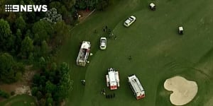 Man seriously injured after pinned under tractor at a Brisbane golf club