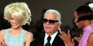 Karl Lagerfeld is applauded by Claudia Schiffer,left,and Naomi Campbell at the end of the Chanel 1997 Spring-Summer ready-to-wear collection show.