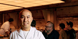 Chef Benny Lam pictured at his Central restaurant with the claypot he uses to cook rice at home.