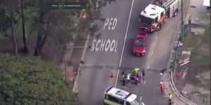 Cyclist dead after collision with car outside Indooroopilly school