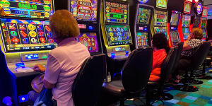 Patrons gamble on the poker machines at Bankstown Sports Club in Sydney