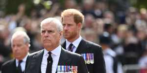 Prince Andrew,Duke of York,and Prince Harry,Duke of Sussex,marched in morning suits behind the coffin with their service medals on display. 