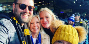 This article’s author and Laidley biographer,with wife Nikki,Leckie and Laidley at a North Melbourne v Richmond match in August.