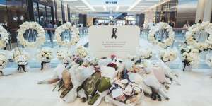 The temporary memorial inside the Westfield Bondi Junction quickly filled up with floral tributes.