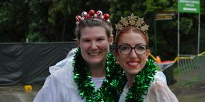 Concert-goers Belinda Edwards and Pip Wright braved wet weather conditions to attend the Christmas fundraiser Pub Choir concert. 