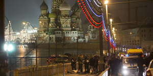 Russian police investigate the the body of Boris Nemtsov,a former Russian deputy prime minister and opposition leader at Red Square with St Basil Cathedral in the background in Moscow,Russia.