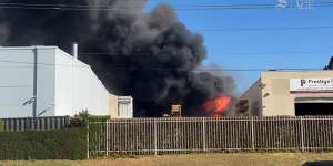 Firefighters are battling a factory fire in Sydney’s southwest