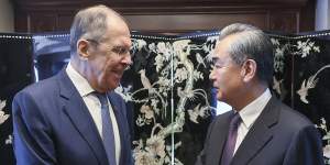 In this photo released by Russian Foreign Ministry Press Service,Russian Foreign Minister Sergey Lavrov,left,and Chinese Communist Party’s foreign policy chief Wang Yi shake hands.