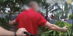 Queensland Police officers search people with metal detection wands under an earlier trial of the increased powers in Gold Coast party precincts.