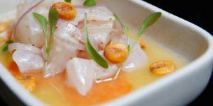 Ceviche Peruano is marinated in'tiger's milk'and scattered with charred corn.