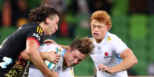 Michael Hooper is tackled by the Chiefs’ Josh Lord at AAMI Park.
