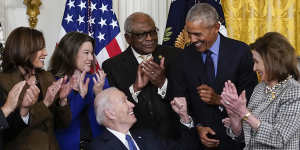 US President Joe Biden in 2022 with predecessor Barack Obama and other Democrat heavyweights,including Nancy Pelosi (right) and James Clyburn (centre).
