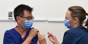Professor Allen Cheng receiving the Pfizer vaccine at The Alfred hospital in March.