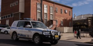 A police vehicle drives through the southern NSW town of Cooma,where 95-year-old Clare Nowland died after she was allegedly Tasered last week. 