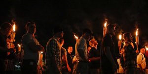 White nationalist groups march through the University of Virginia campus in Charlottesville.