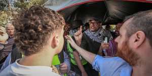 Palestinian and Israeli supporters confront each other at Monash University on Wednesday.