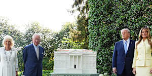 Queen Camilla and King Charles pose with Donald Trump and Melania Trump next to the recently unveiled beehive.