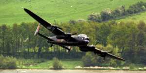 A Lancaster bomber swoops over Eyebrook Reservoir in central England,May 17,2003 to mark the 60th anniversary of the Dambuster raid. 