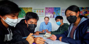 Tutor and former VCE chemistry teacher James Kennedy teaches year 9 and 10 students at his tuition centre. 