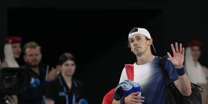 Demon defeated:Alex de Minaur waves to the crowd after his quarter-final loss.