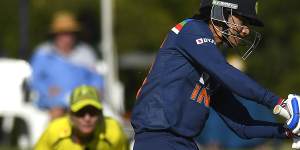 Smriti Mandhana,who has just signed for Sydney Thunder,taking on Australia in the ODI.